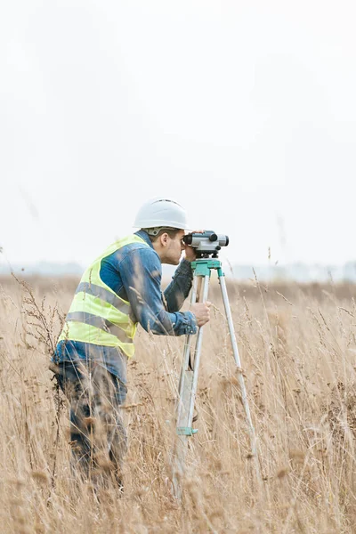 stock photo surveyor digital level measuring field